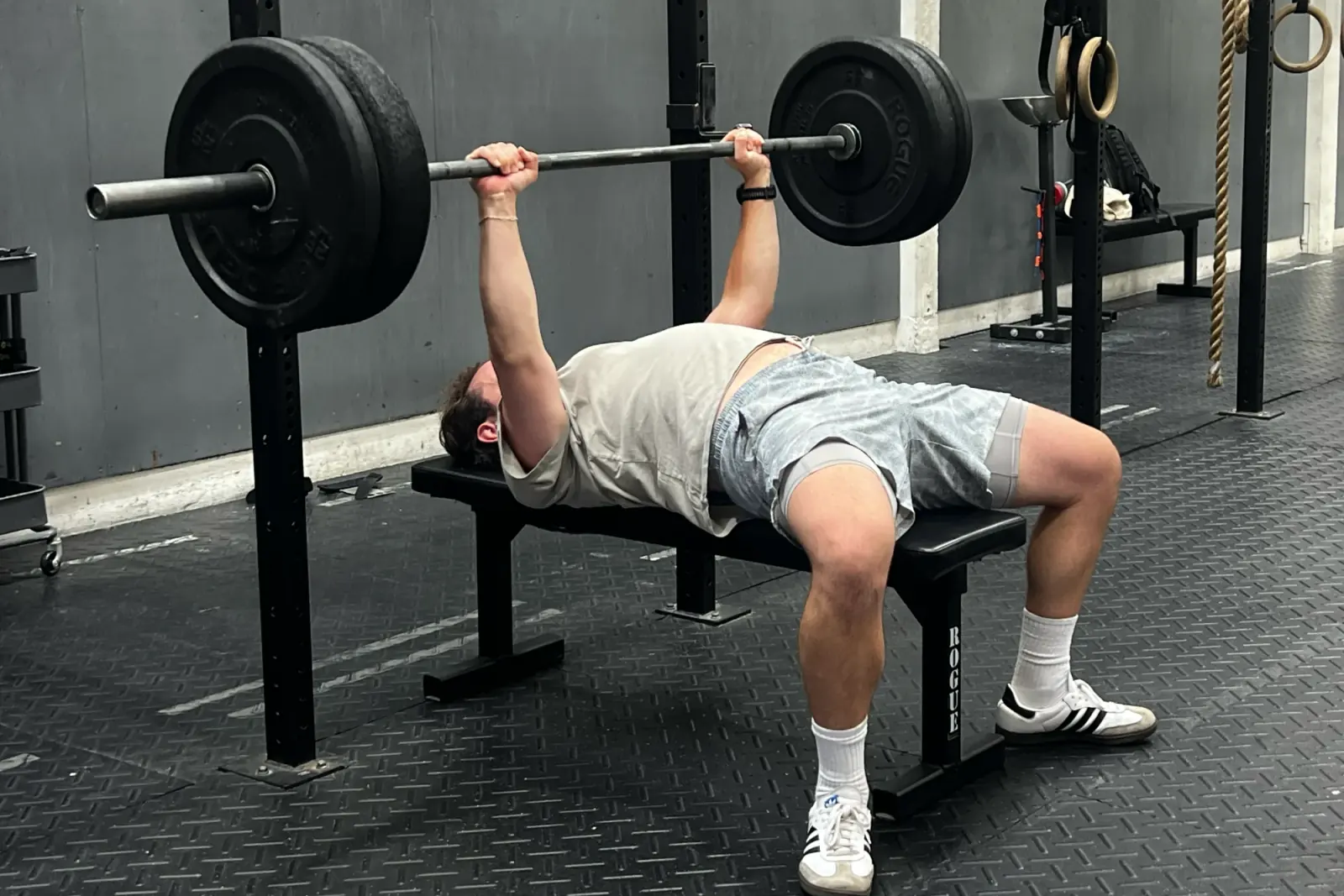 A participant bench pressing during a Life Stages strength session