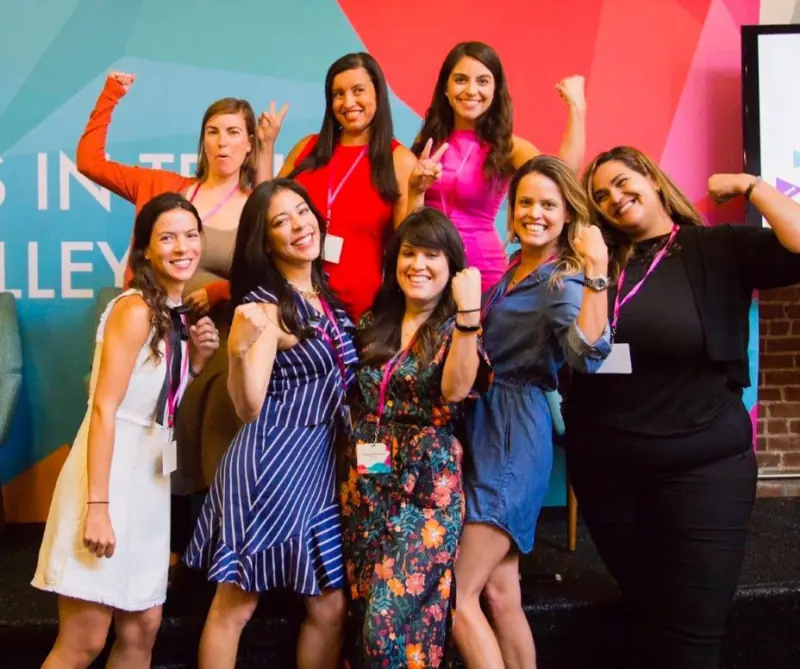A group of women celebrating at a Latinas in Tech event
