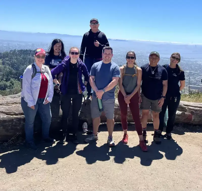 REI Berkeley team members on a hilltop trail