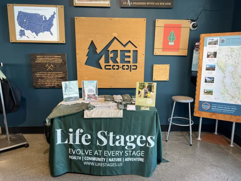 The Life Stages table at an REI meet and greet